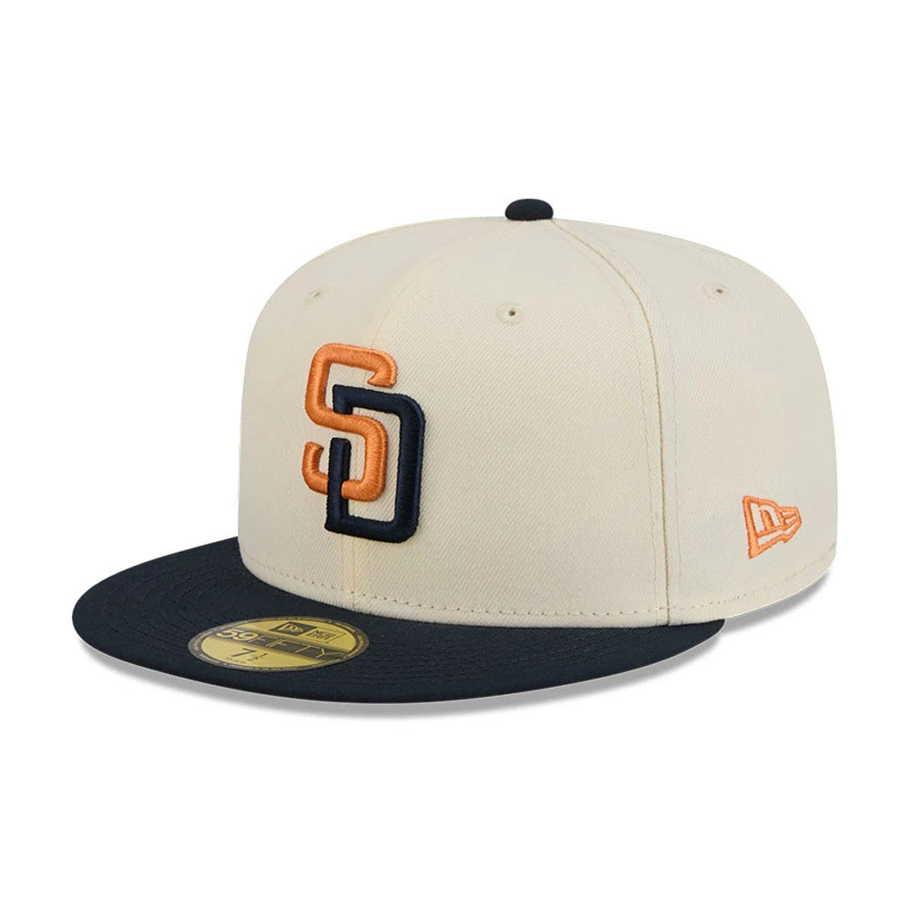 San Diego Padres MLB City Connect Cream New Era 59FIFTY Fitted Cap, front view showing the raised SD logo embroidered in orange and navy on the cream front panel, with a black flat visor and a gold 59FIFTY size sticker.