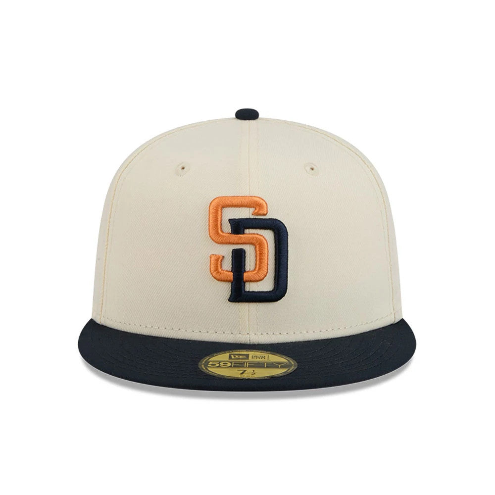 San Diego Padres MLB City Connect Cream New Era 59FIFTY Fitted Cap, front view showing a raised embroidered SD logo in orange and navy on the structured cream front panel, contrasted by a navy visor with a gold 59FIFTY size sticker.