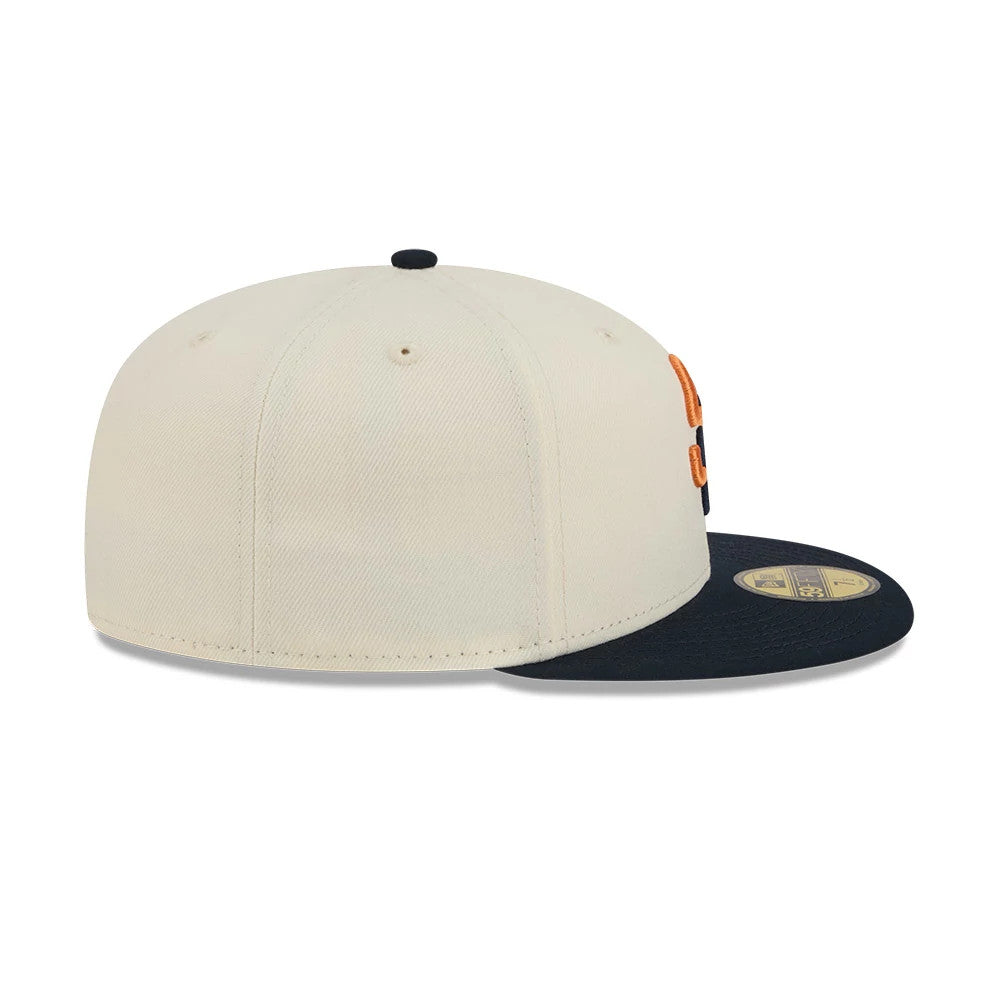 San Diego Padres MLB City Connect Cream New Era 59FIFTY Fitted Cap, side view showing the structured cream crown with a slightly curved navy visor, an orange raised embroidered logo on the front panel, and a gold 59FIFTY size sticker on the visor.