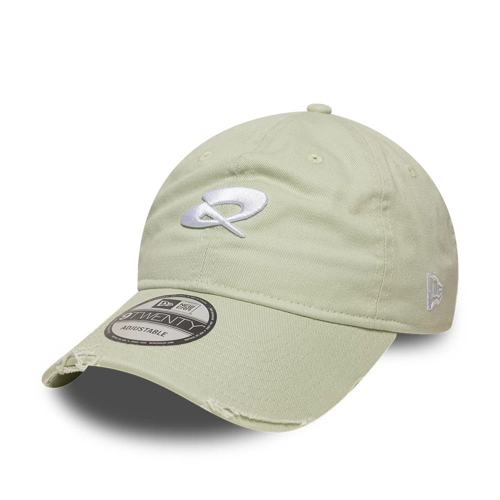 Quadrant X New Era Distressed Pastel Green 9TWENTY Cap, three-quarter view showing the white embroidered logo on the front panel, distressed on the curved visor, and the 9TWENTY size sticker on the front.