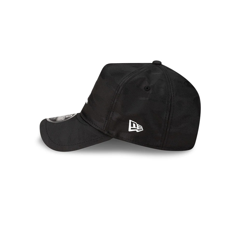 New Era Black 9FORTY Apex Cap, side view showing the white embroidered New Era flag logo on the left side of the black structured crown, with a curved black visor featuring a 9FORTY size sticker, and two black embroidered eyelets.