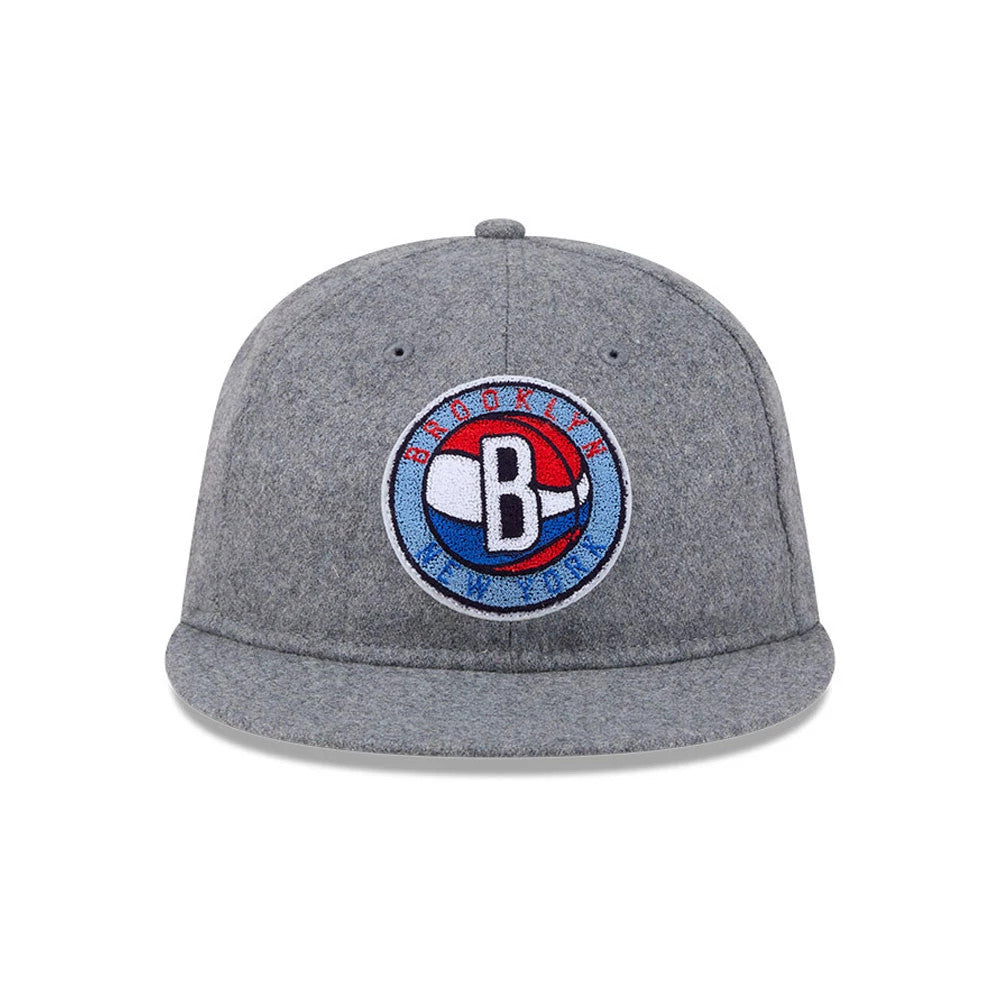 Brooklyn Nets NBA Chenille Woven Grey Retro Crown New Era 9FIFTY Adjustable Cap, front view showing a large multicoloured Brooklyn Nets logo in raised embroidery on the front panel, complemented by the grey curved visor and top button.