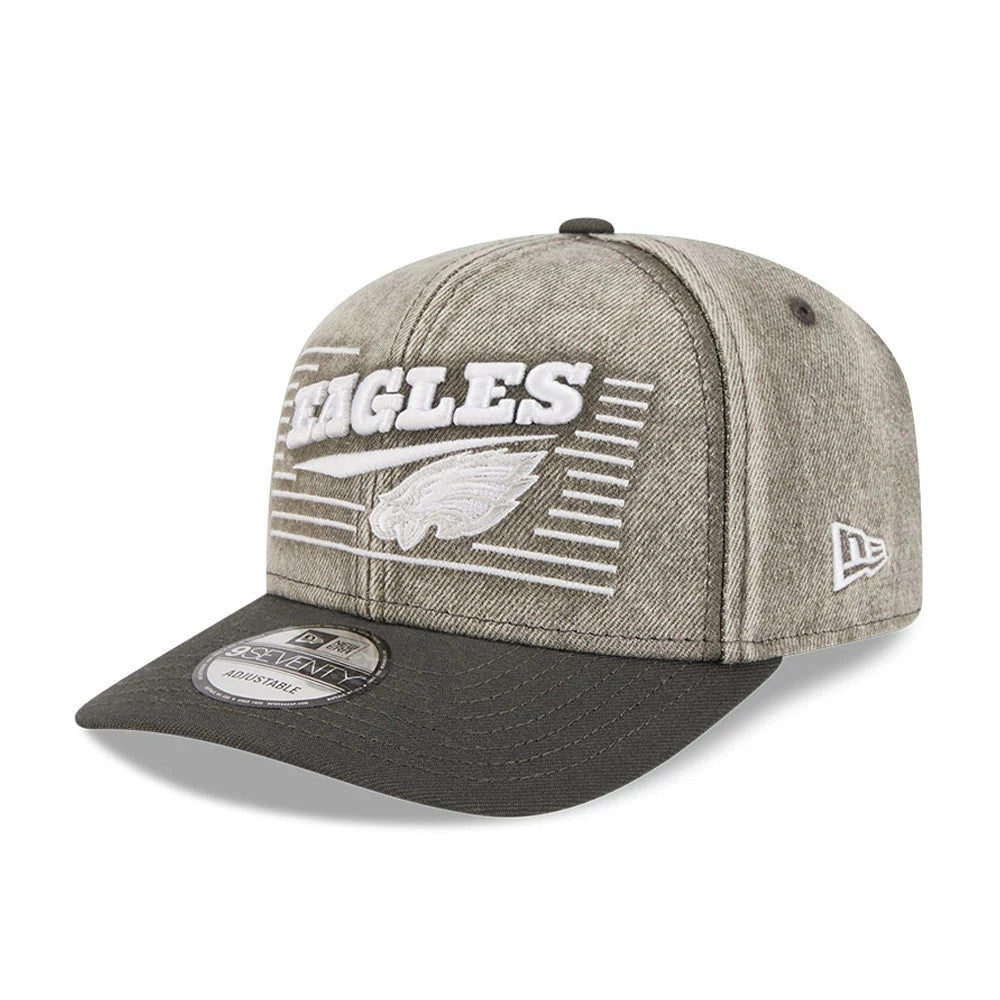 Philadelphia Eagles NFL Washed Denim Dark Grey New Era 9SEVENTY Stretch Snap Cap, front view showing raised white Eagles logo and team name embroidery across the grey washed denim crown, with a curved dark grey visor and 9SEVENTY size sticker.