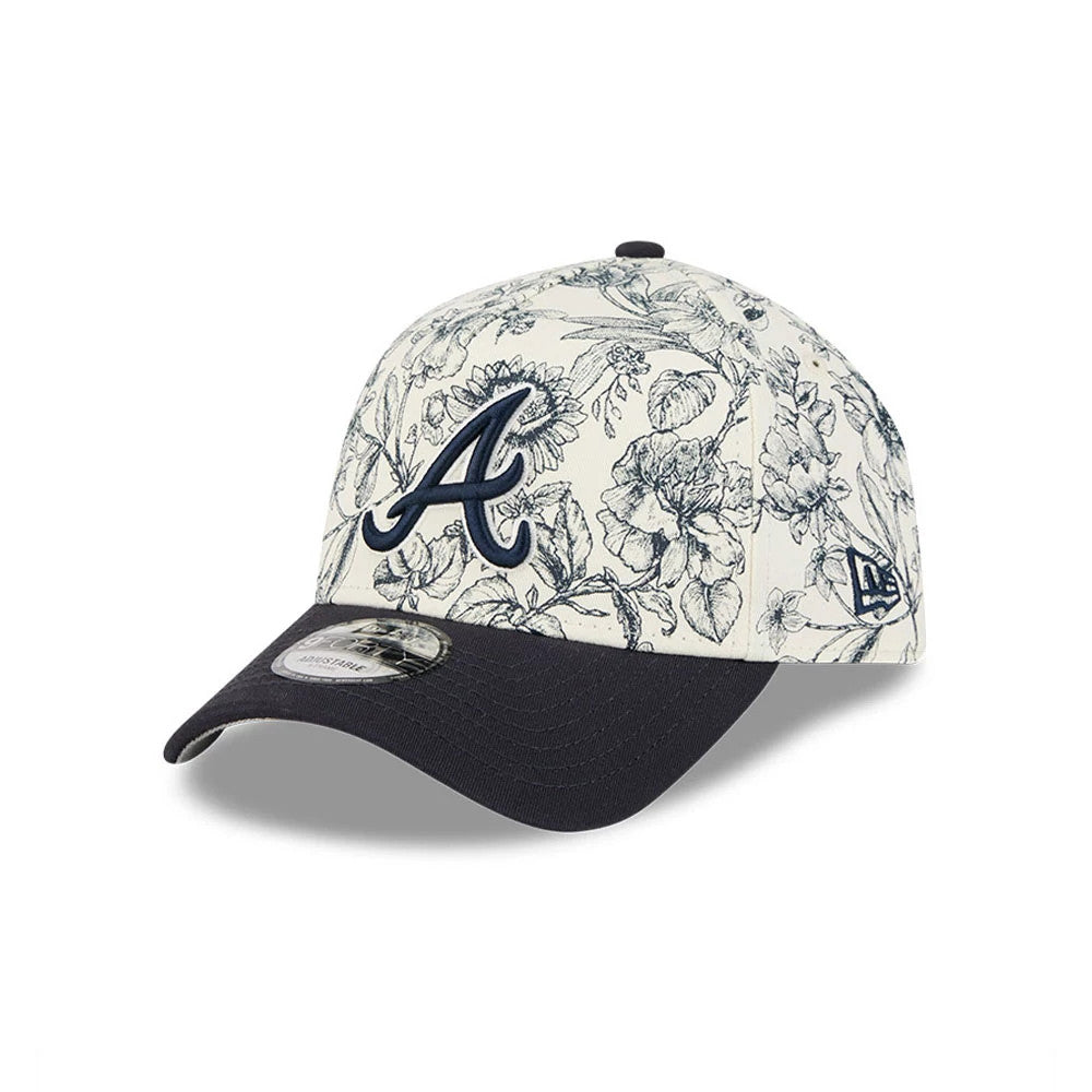 Atlanta Braves MLB Spring Floral Navy New Era 9FORTY A-Frame Adjustable Cap, three-quarter view showing the navy embroidered A logo on the floral-patterned crown, with a navy curved visor and a 9FORTY size sticker.