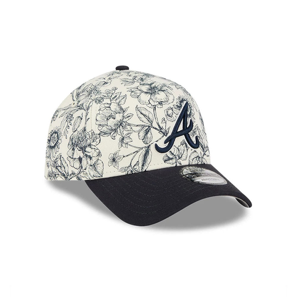 Atlanta Braves MLB Spring Floral Navy New Era 9FORTY A-Frame Adjustable Cap, front view showing a raised navy embroidered A logo on the structured floral crown, contrasted with a navy curved visor and a 9FORTY size sticker.
