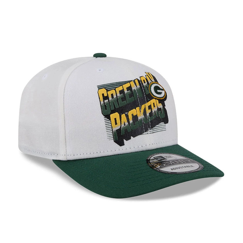 Green Bay Packers NFL Duck Cloth White New Era 9SEVENTY Stretch Snap Cap, front view showing raised embroidered Green Bay Packers logo in green and gold on a white crown, with a contrasting green visor and 9SEVENTY size sticker.