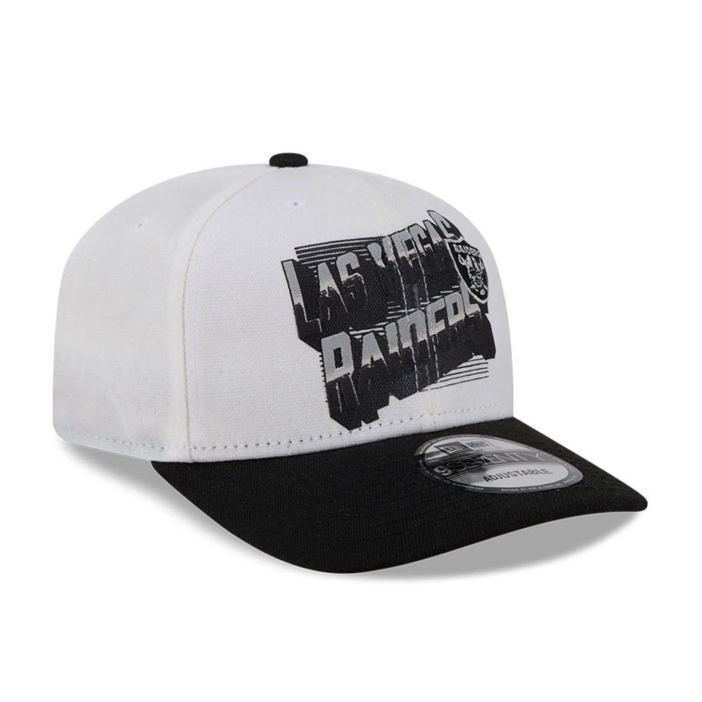 Las Vegas Raiders NFL Duck Cloth White New Era 9SEVENTY Stretch Snap Cap, three-quarter view showing the black and grey Las Vegas Raiders lettering with a Raiders crest on the front panels, black visor, and 9SEVENTY size sticker.