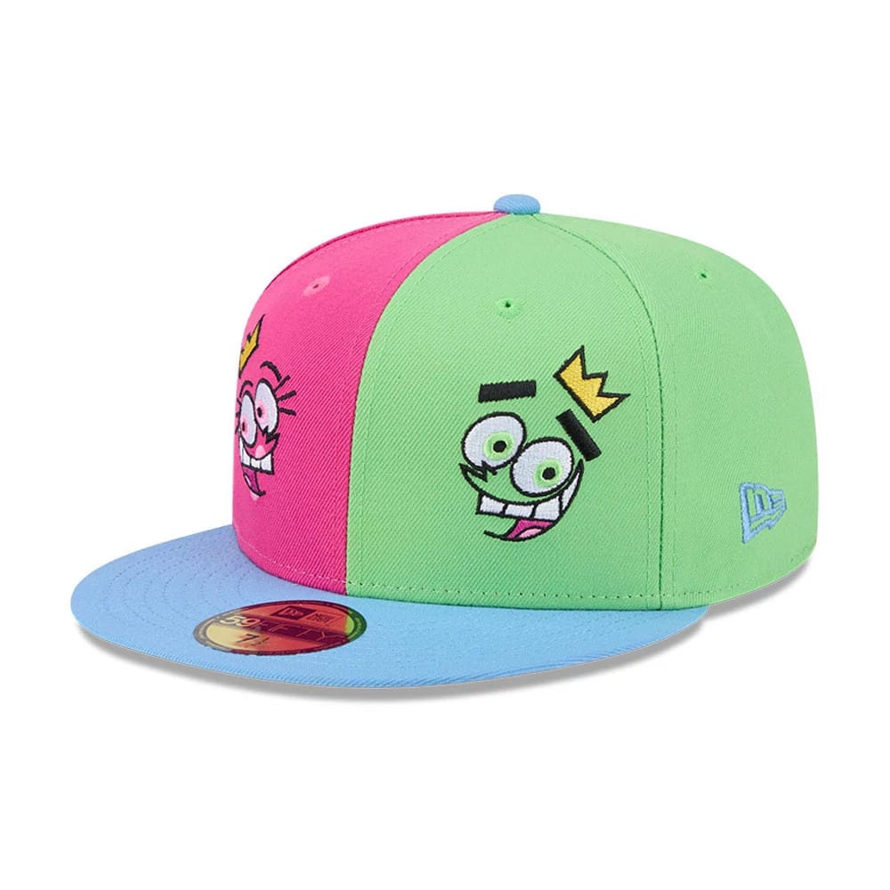 Nickelodeon Fairly Oddparents Multi New Era 59FIFTY Fitted Cap, three-quarter view showing colourful character embroidery on a green and pink crown, blue visor with gold 59FIFTY size sticker, and blue New Era flag logo on the left side.