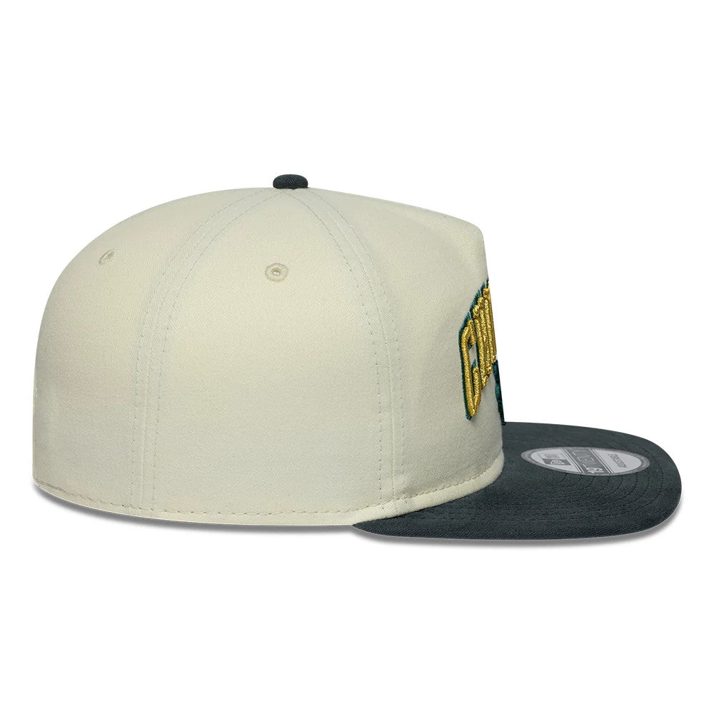 Chicago Bulls NBA Metallic Logo Cream New Era 19TWENTY Adjustable Cap, side view showing a raised yellow and black embroidered team logo on the structured cream crown, with a flat dark visor and a 19TWENTY size sticker on top.