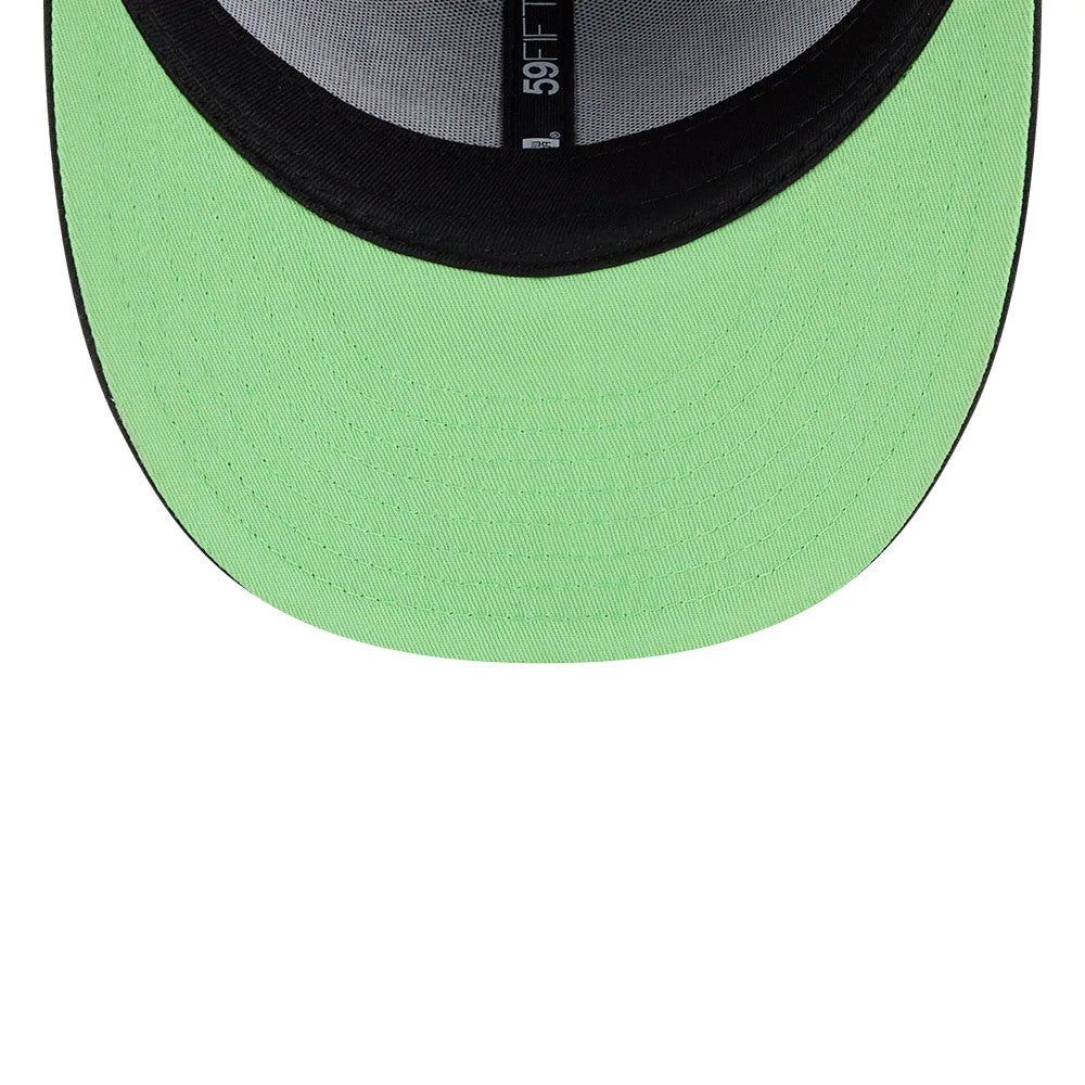 Warner Bros Logo Dexter's Laboratory Black New Era 59FIFTY Fitted Cap, inside view showing a bright green undervisor, the black sweatband, and the 59FIFTY taping along the centre with a black and grey colourway.