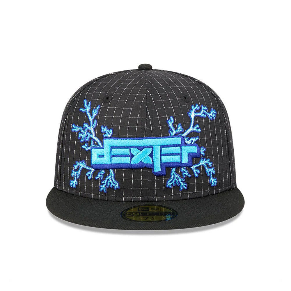 Dexter's Laboratory Electric Black New Era 59FIFTY Fitted Cap, front view showing the large blue embroidered 'Dexter' logo with electric branches on a black grid-patterned crown, featuring a flat black visor with a gold 59FIFTY size sticker.