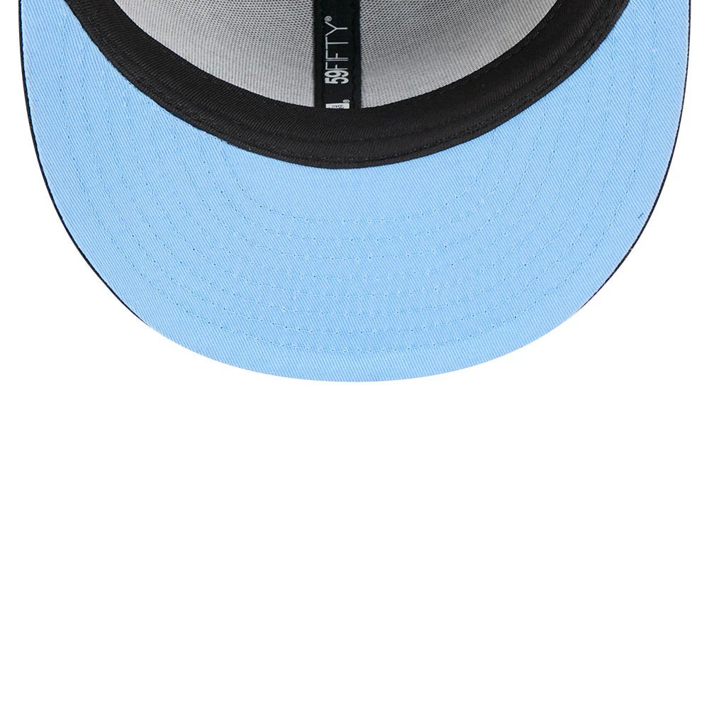 Dexter's Laboratory Electric Black New Era 59FIFTY Fitted Cap, inside view showing a blue undervisor, black taping with a 59FIFTY label, and a grey sweatband lining the interior of the structured crown.