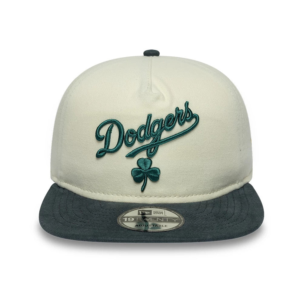 LA Dodgers MLB Metallic Logo Cream New Era 19TWENTY Adjustable Cap, front view showing teal raised embroidery of Dodgers script and shamrock motif on the cream crown, paired with a contrasting teal visor and 19TWENTY size sticker.