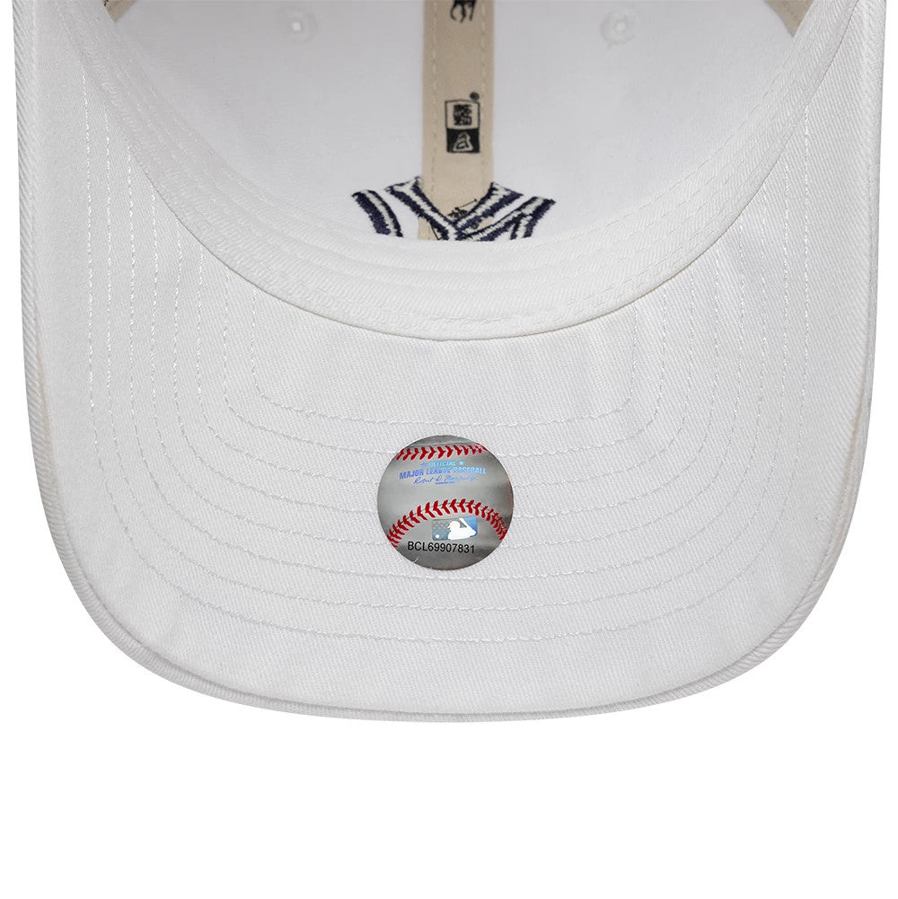 New York Yankees Ralph Lauren X MLB White New Era 9TWENTY Adjustable Cap, inside view showing an MLB baseball-themed sticker on the white undervisor, navy embroidered logo on the taping, and white eyelets on the crown.