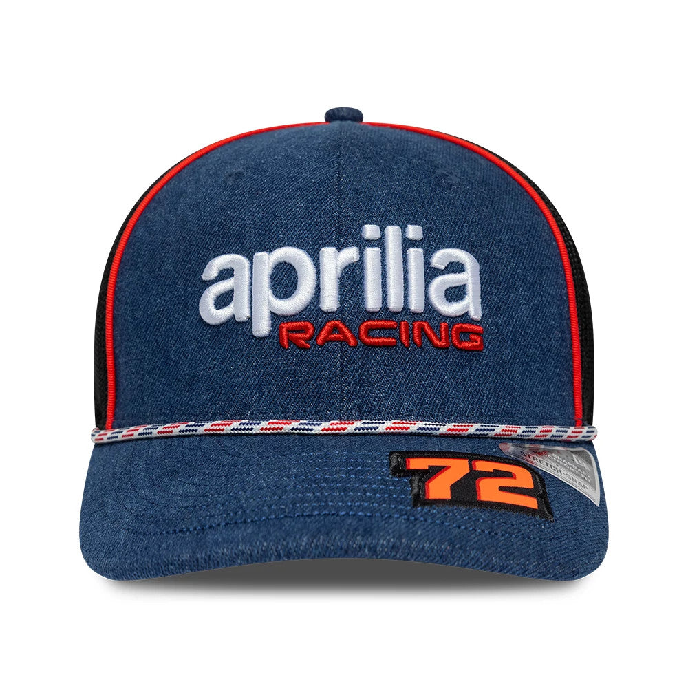 Aprilia Replica Marco Bezzecchi Austin Race Special Blue New Era 9SEVENTY Stretch Snap Adjustable Cap, front view showing raised white aprilia and red RACING embroidery on the blue crown, with red piping details and orange 72 graphic on the visor.