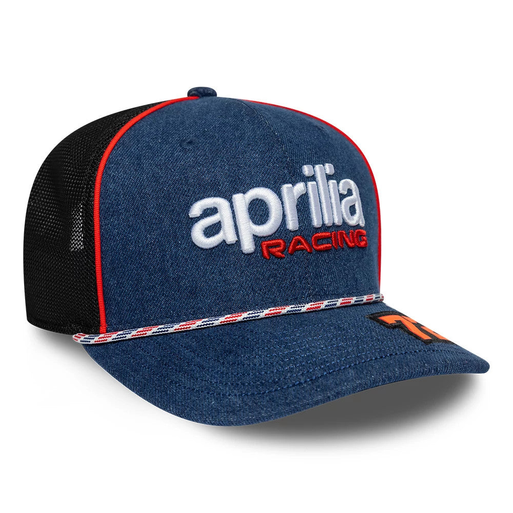 Aprilia Replica Marco Bezzecchi Austin Race Special Blue New Era 9SEVENTY Stretch Snap Adjustable Cap, front view showing white and red embroidered Aprilia Racing logo on the denim blue front panel, with red and a braided rope on the visor.