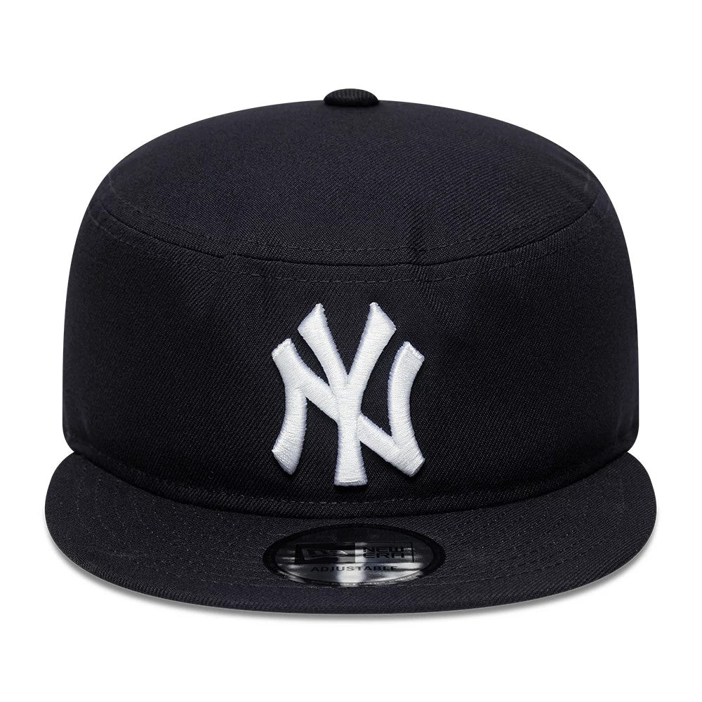 New Era New York Yankees MLB Poly Navy Pillbox Adjustable Cap, front view showing a white embroidered NY logo on the front panel with a navy flat visor, and a black adjustable size sticker on the centre of the visor.