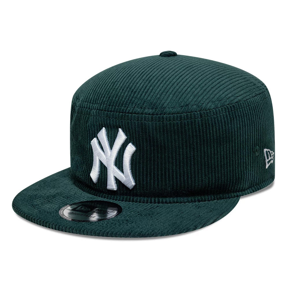 New Era New York Yankees MLB Cord Dark Green Pillbox Adjustable Cap, three-quarter view showing the raised white NY logo embroidered on the front panel, dark green corduroy texture with a flat matching visor, and a 9FORTY size sticker.