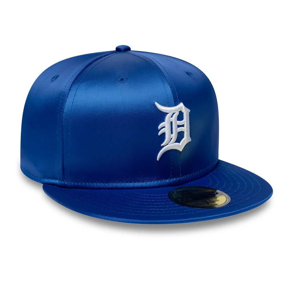 Detroit Tigers MLB Satin Blue New Era 59FIFTY Fitted Cap, three-quarter view showing the raised white Old English D logo embroidered on the front panel, with a satin finish, blue flat visor, and gold 59FIFTY size sticker.