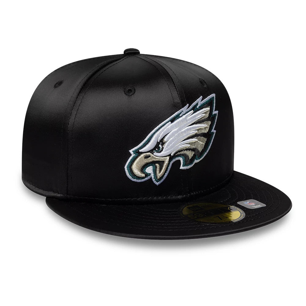 Philadelphia Eagles NFL Satin Black New Era 59FIFTY Fitted Cap, front view showing the grey and white embroidered Eagles logo on the front panel, complemented by a black visor with a gold 59FIFTY size sticker on top.