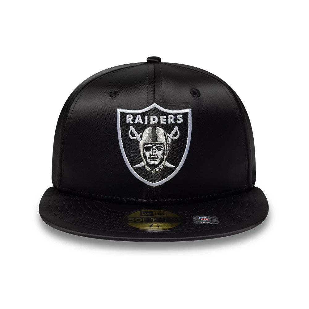 Las Vegas Raiders NFL Satin Black New Era 59FIFTY Fitted Cap, front view showing the silver and white embroidered Raiders shield logo on the structured black satin crown, with a gold 59FIFTY size sticker on the flat black visor.