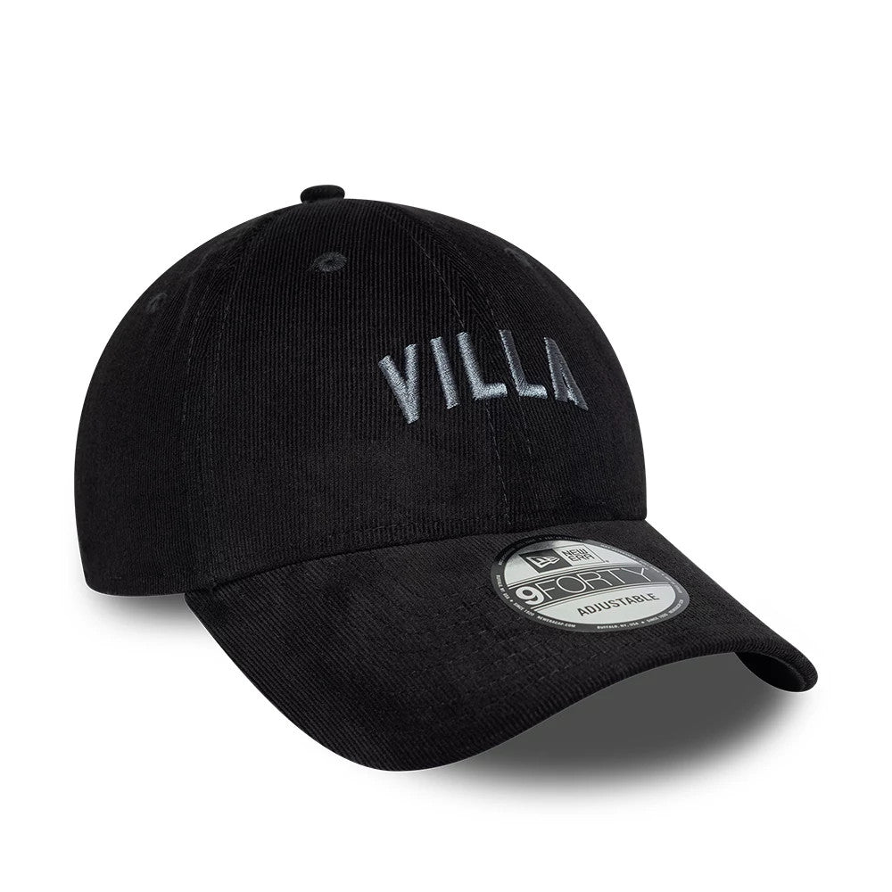 Aston Villa FC Cord Black New Era 9FORTY Adjustable Cap, three-quarter view showing the grey embroidered VILLA wordmark on the front panel, with a curved visor featuring a 9FORTY size sticker and a corduroy texture on the structured black crown.