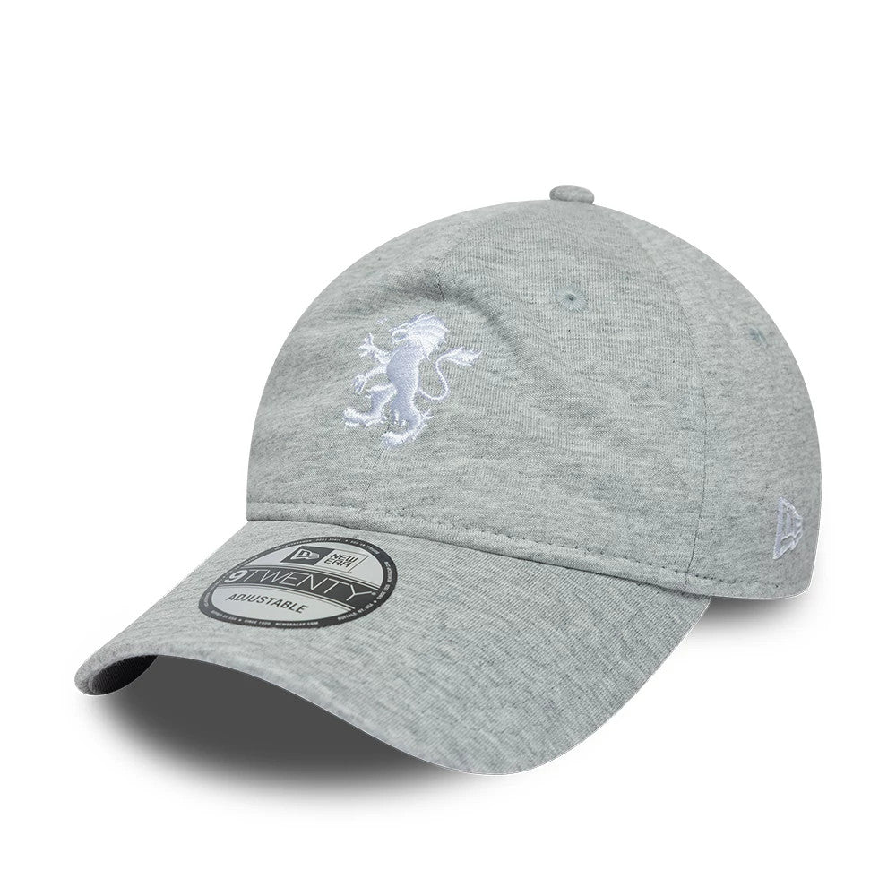 Aston Villa FC Jersey Grey New Era 9TWENTY Adjustable Cap, three-quarter view showing a white embroidered lion logo on the front panel, a curved visor with a 9TWENTY size sticker, and the New Era flag logo on the left side.