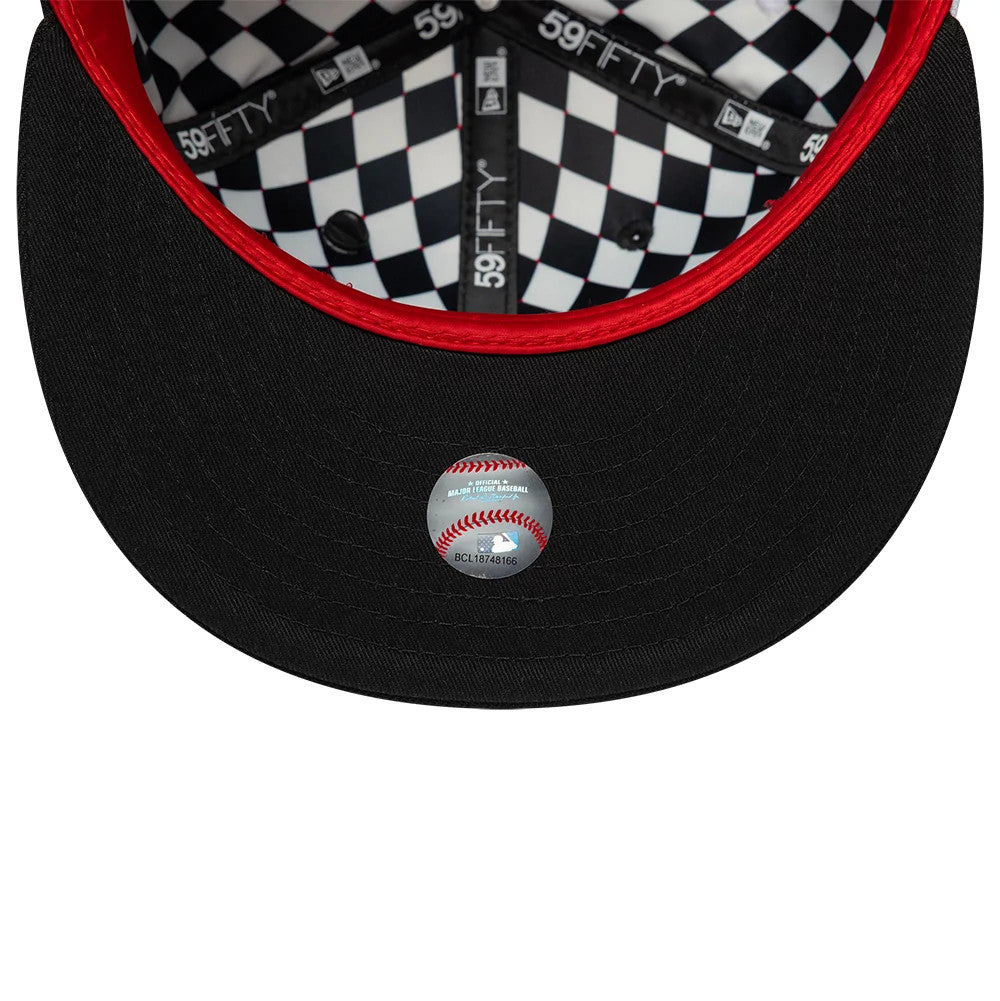 New York Yankees MLB Pinwheel Black New Era 59FIFTY Fitted Cap, inside view showing the black and white checkered sweatband, red-lined seams, and black undervisor with a baseball graphic size sticker at the centre.