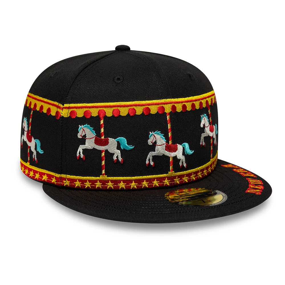 New Era Carousel Black 59FIFTY Fitted Cap, three-quarter view showing embroidered carousel horses around the crown with a red and yellow design, a flat black visor with gold 59FIFTY size sticker and red logo detail on the visor edge.