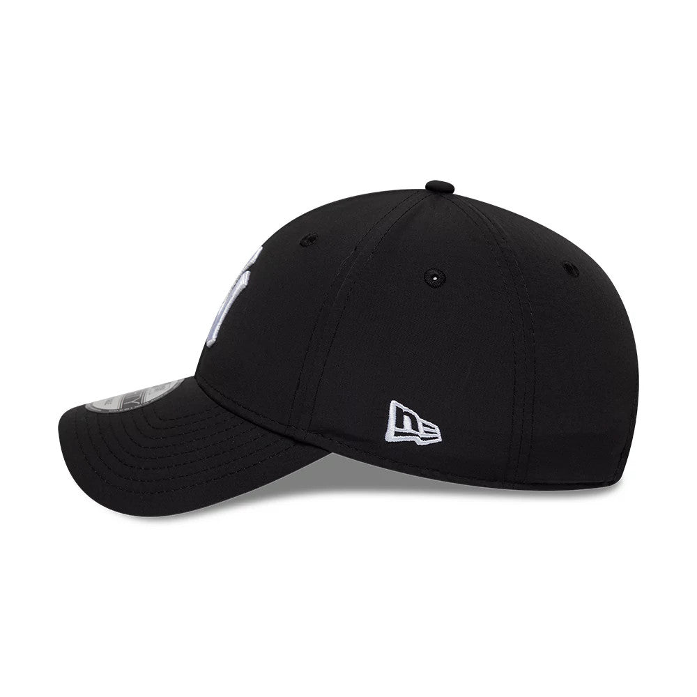 New York Yankees MLB Recycled Black New Era 9FORTY Adjustable Cap, side view showing the white embroidered New Era flag logo on the left side, curved black visor, and a glimpse of the white front panel logo.