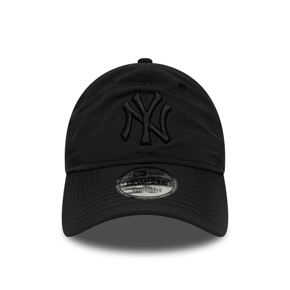 New York Yankees MLB Recycled Black On Black New Era 9TWENTY Adjustable Cap, front view showing the black raised embroidered NY logo on the front panel, a curved visor with a 9TWENTY size sticker, and a black top button.