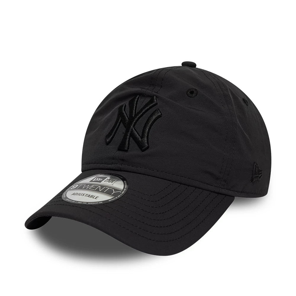 New York Yankees MLB Recycled Black On Black New Era 9TWENTY Adjustable Cap, front view showing the all-black embroidered NY logo on the unstructured crown, curved black visor with a 9TWENTY size sticker, and New Era flag logo on the left side.