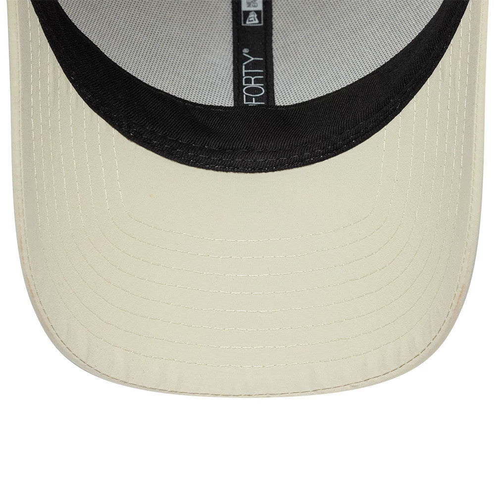New Era Mini Logo Recycled Light Beige 9FORTY Adjustable Cap, inside view showing the black sweatband lining along the edge of the light beige visor and distinct black taping with 9FORTY branding along the crown's interior.