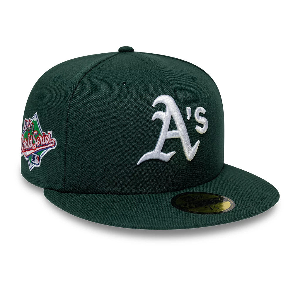 Athletics MLB Sidepatch Satin Lined Dark Green New Era 59FIFTY Fitted Cap, front view showing the white embroidered A's logo on the front panel, with a 2022 World Series side patch on the left and a gold 59FIFTY size sticker on the flat visor.