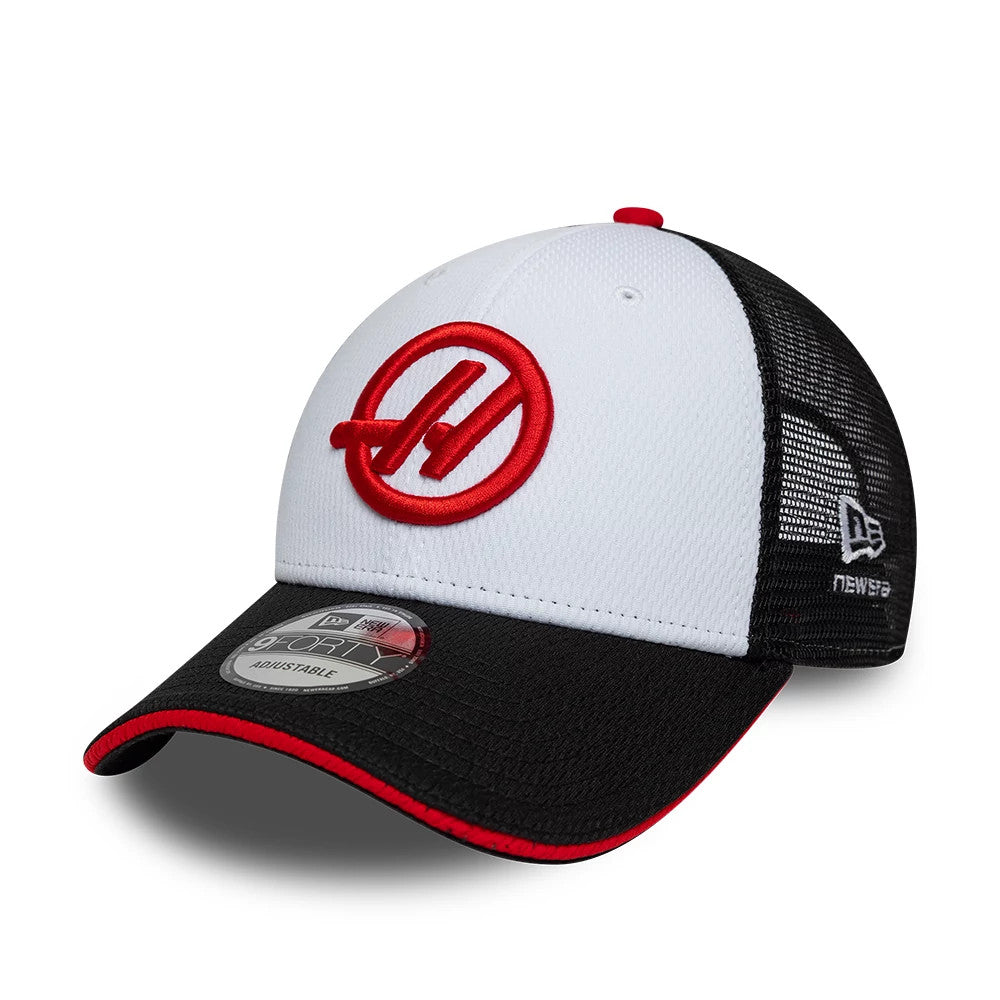TGR Haas F1 Summer League Black New Era 9FORTY Adjustable Cap, three-quarter view showing the red embroidered Haas logo on the white front panel, complemented by a black visor with a red trim, and a 9FORTY size sticker on the visor.
