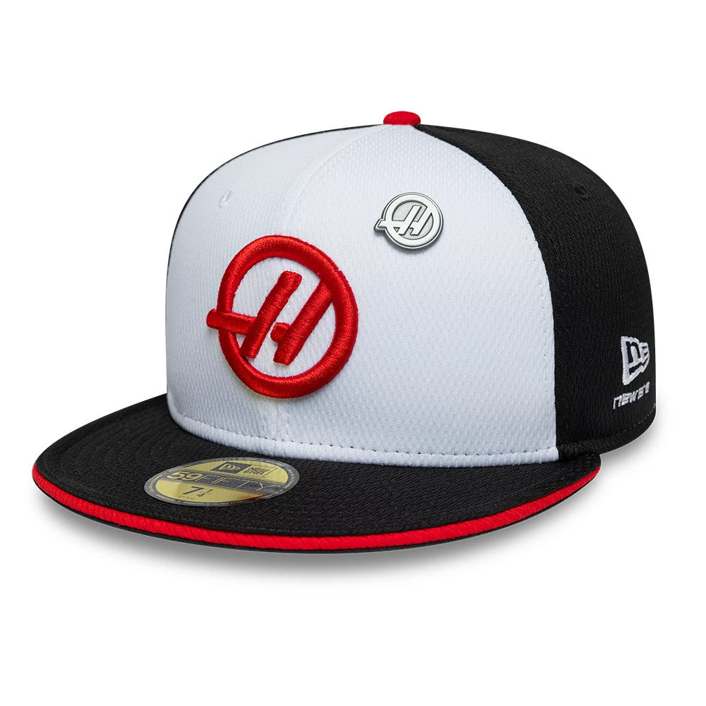 TGR Haas F1 Summer League Black New Era 59FIFTY Fitted Cap, front view showing a red embroidered Haas logo on the white front panel, black flat visor with a red trim, and a 59FIFTY size sticker on the visor.