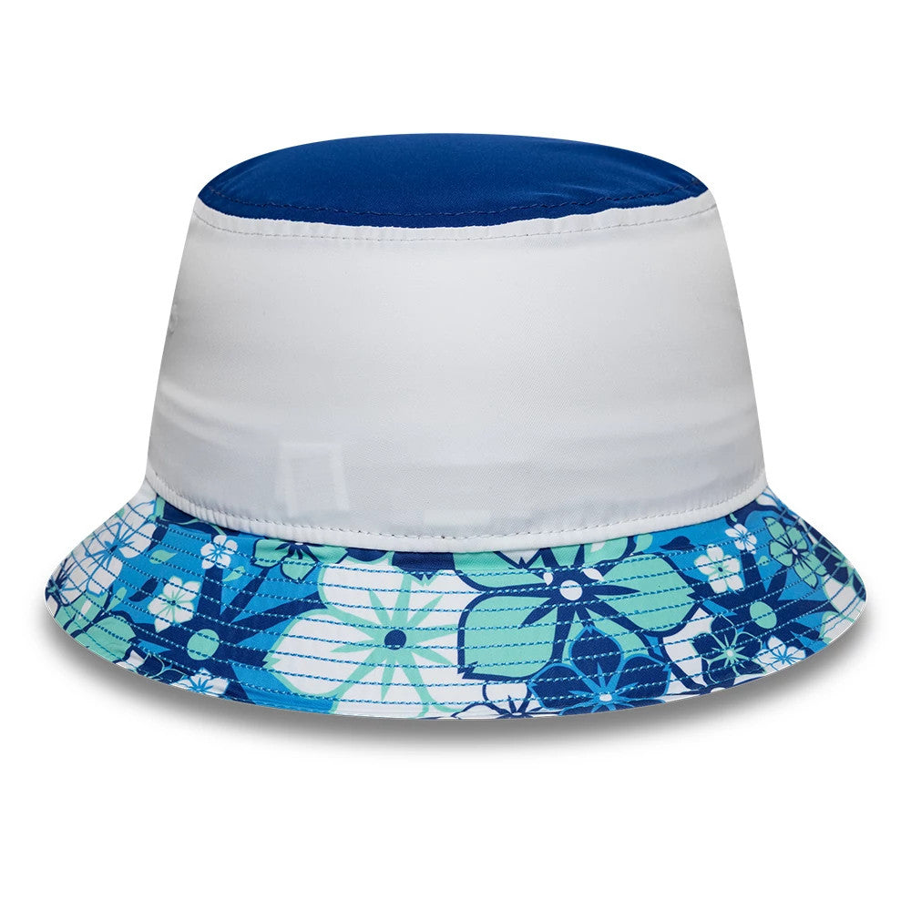 New Era TGR Haas F1 Japan Race Special White Bucket Hat, front view showing a plain white crown with a contrasting blue top panel and a colourful floral-patterned visor in shades of blue and green.