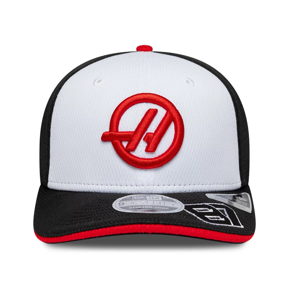 Pictured is this Oliver Bearman TGR Haas F1 9SEVENTY Stretch Snap cap in black. 3
