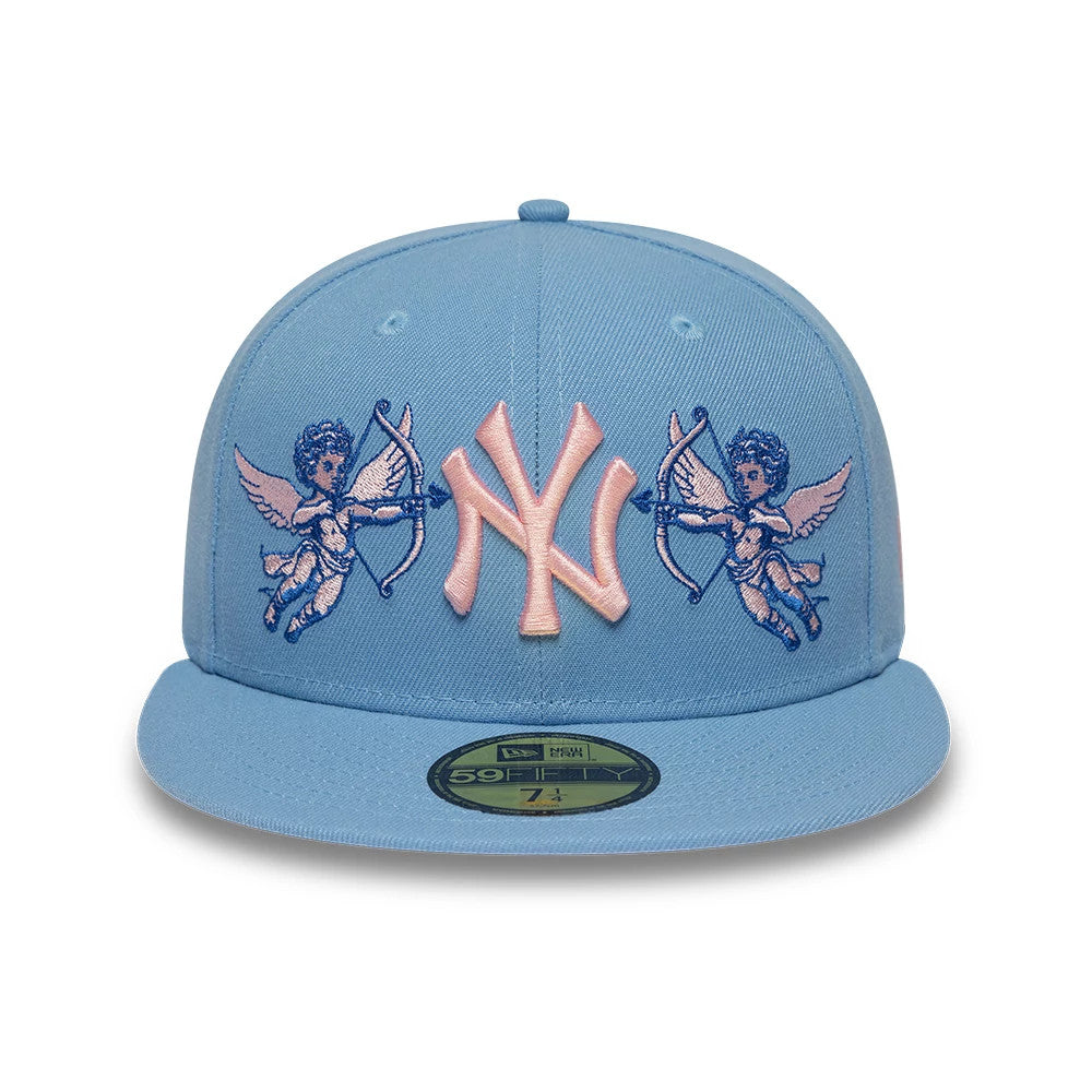New York Yankees MLB Cherub Pastel Blue New Era 59FIFTY Fitted Cap, front view showing the pink raised embroidered NY logo flanked by blue cherub designs on the front panel, with a gold 59FIFTY size sticker on the flat pastel blue visor.