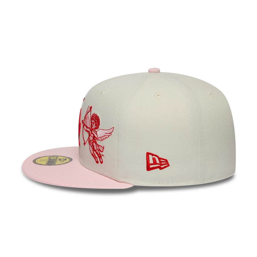 LA Dodgers MLB Cherub Cream & Pink New Era 59FIFTY Fitted Cap, side view showing a detailed red cherub embroidery on the front panels, paired with a pink flat visor and the red New Era flag logo on the left side.
