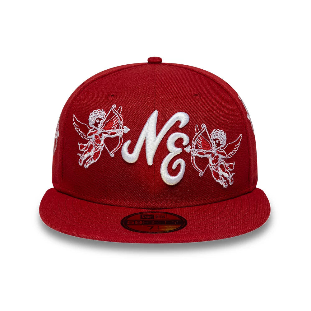 New Era Cherub Dark Red 59FIFTY Fitted Cap, front view showing a central raised white NE embroidered logo flanked by two white embroidered cherub designs on a structured dark red crown, with a flat red visor and a gold 59FIFTY size sticker.