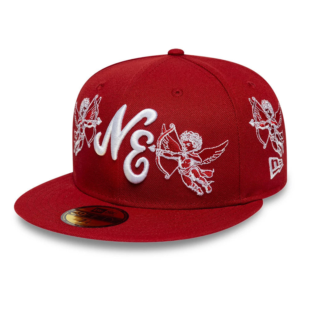 New Era Cherub Dark Red 59FIFTY Fitted Cap, three-quarter view showing white embroidered cherub designs on the front and side panels, NE lettering in raised embroidery on the front, and a gold 59FIFTY size sticker on the flat dark red visor.