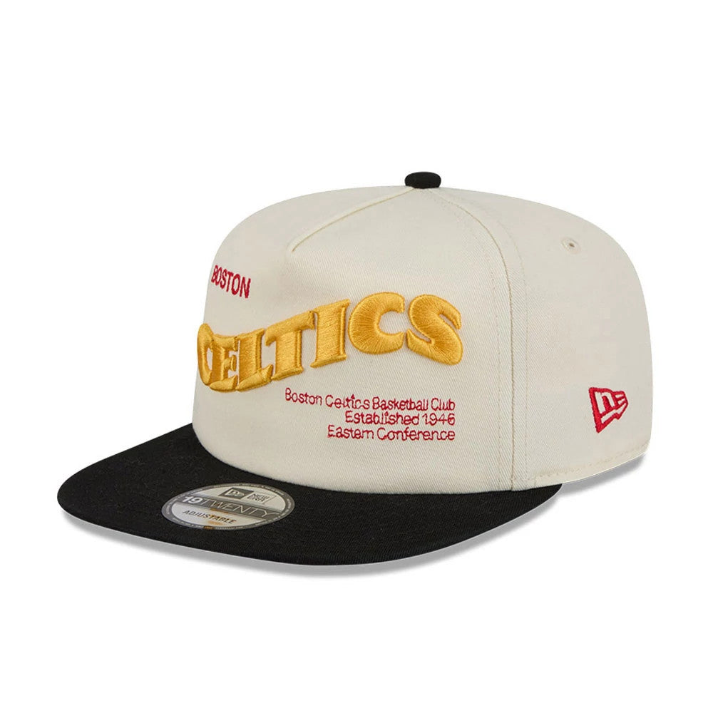 Boston Celtics NBA Conference Script White New Era 19TWENTY Adjustable Cap, three-quarter view showing a large gold Celtics front panel embroidery, contrasting black visor with 19TWENTY size sticker, and red New Era flag logo on the left side.