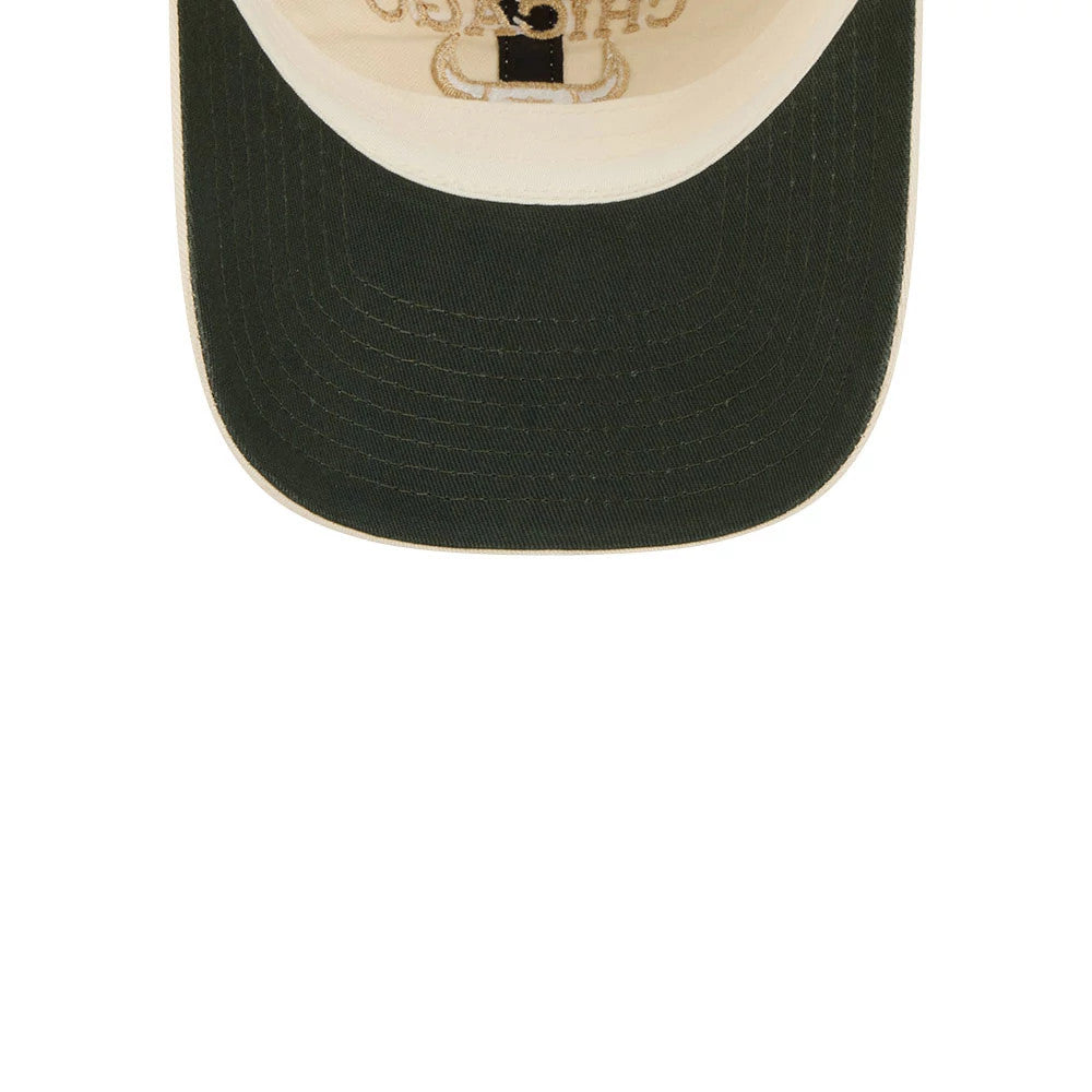 New Era Chicago Bulls NBA Team Logo Beige Casual Classic Adjustable Cap, inside view showing the cream-coloured taping, a dark green undervisor, and the embroidered Chicago Bulls logo through the crown fabric.