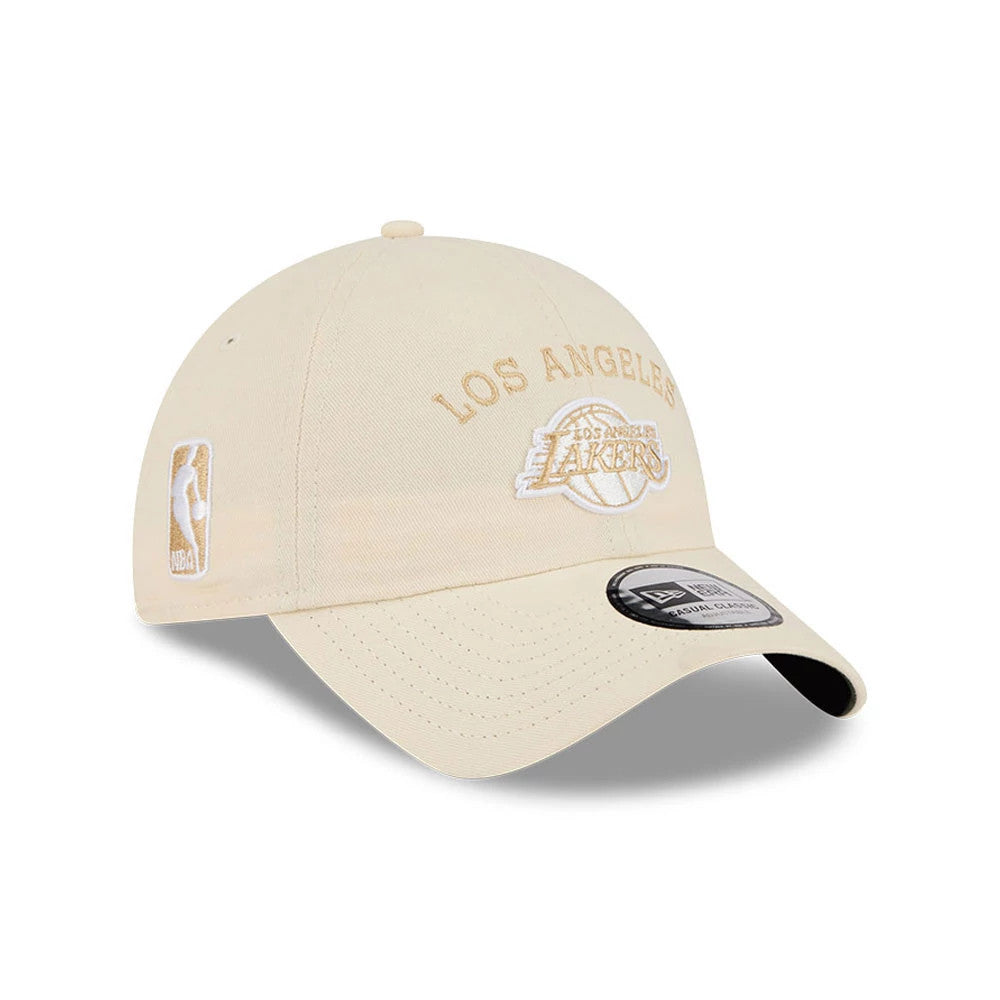 New Era LA Lakers NBA Team Logo White Casual Classic Adjustable Cap, three-quarter view showing the raised embroidered Los Angeles Lakers logo in yellow on the front panel, a white NBA logo on the left side.