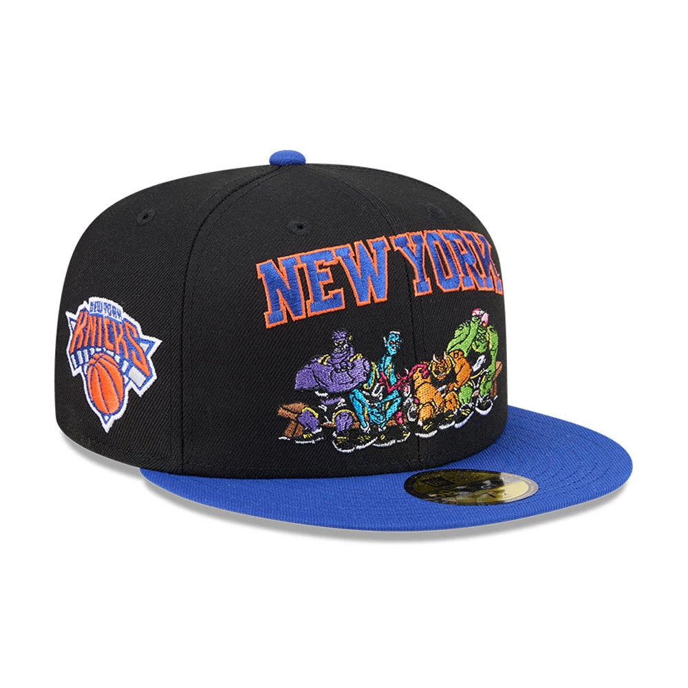 New York Knicks Space Jam Monstars Black New Era 59FIFTY Fitted Cap, three-quarter view showing the orange and blue New York lettering, colourful Monstars embroidery across the front panels, a blue flat visor, and a gold 59FIFTY size sticker.