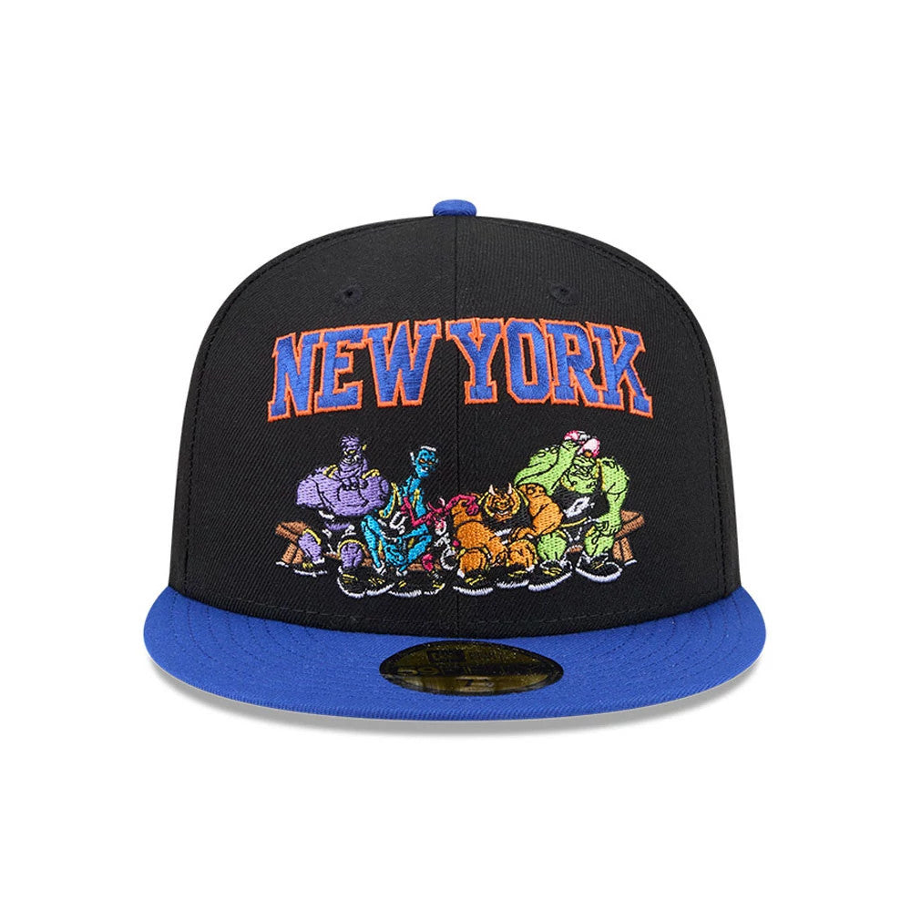 New York Knicks Space Jam Monstars Black New Era 59FIFTY Fitted Cap, front view showing the orange and blue raised embroidered 'New York' lettering above multicoloured Monstars graphics, with a blue flat visor and a gold 59FIFTY size sticker.