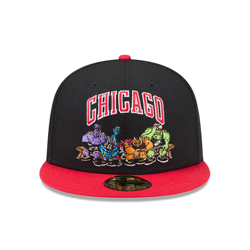Chicago Bulls Space Jam Monstars Black New Era 59FIFTY Fitted Cap, front view showing the red and white embroidered 'Chicago' lettering above a colourful embroidered graphic of the Monstars, with a bright red visor and gold 59FIFTY size sticker.