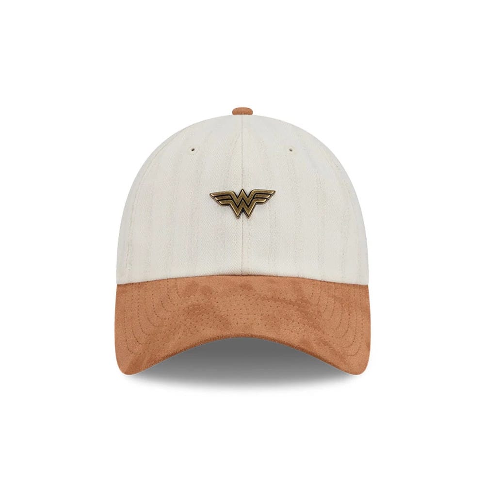 New Era Womens DC Wonder Woman White Casual Classic Adjustable Cap, front view showing a gold raised embroidered Wonder Woman logo on the centre of the white crown, with a contrasting light brown suede visor and matching top button.