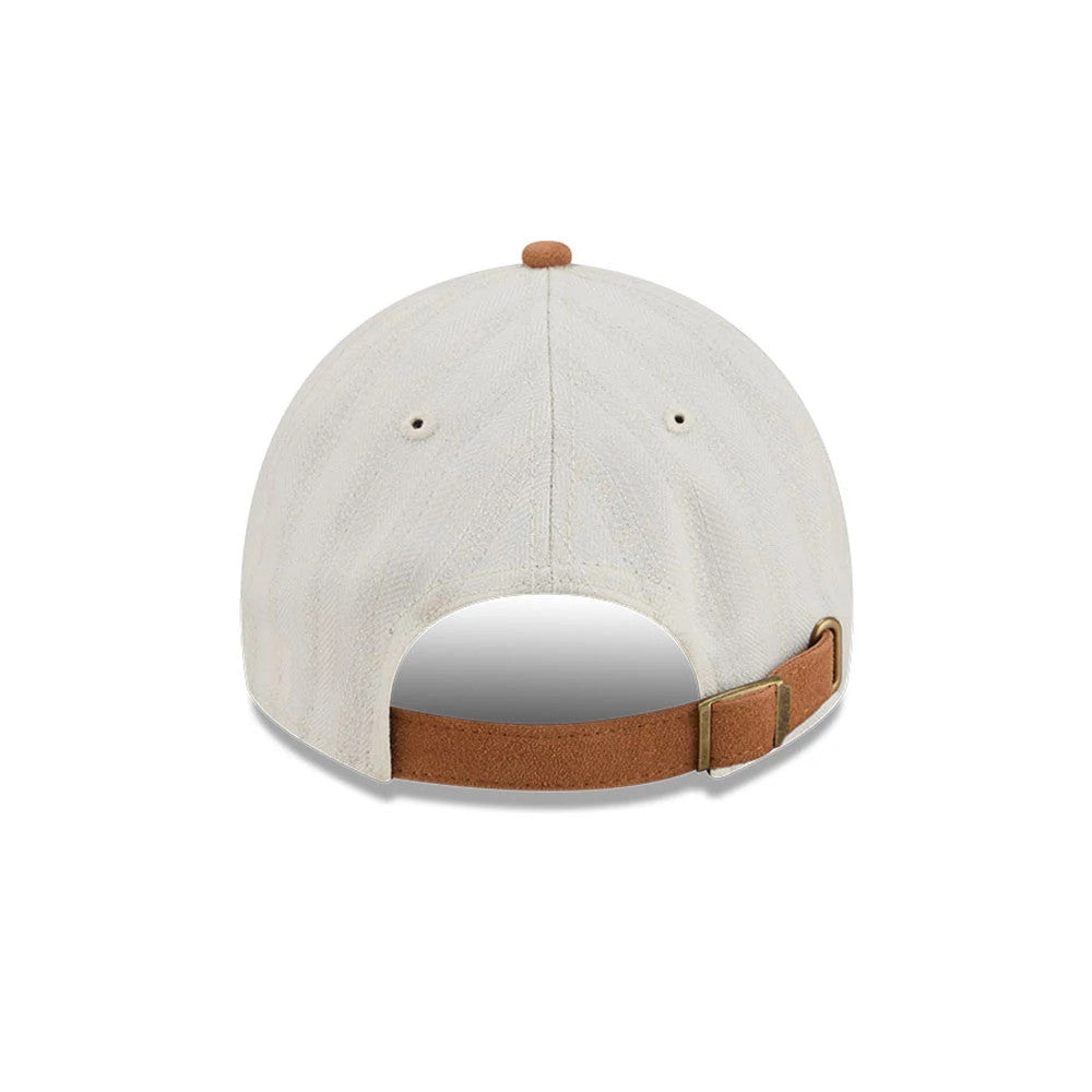 New Era Womens DC Wonder Woman White Casual Classic Adjustable Cap, rear view showing a light brown strap with a buckle, two small eyelets on the white crown, and a matching light brown top button.